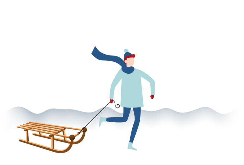 Junge mit SChlitten im Schnee